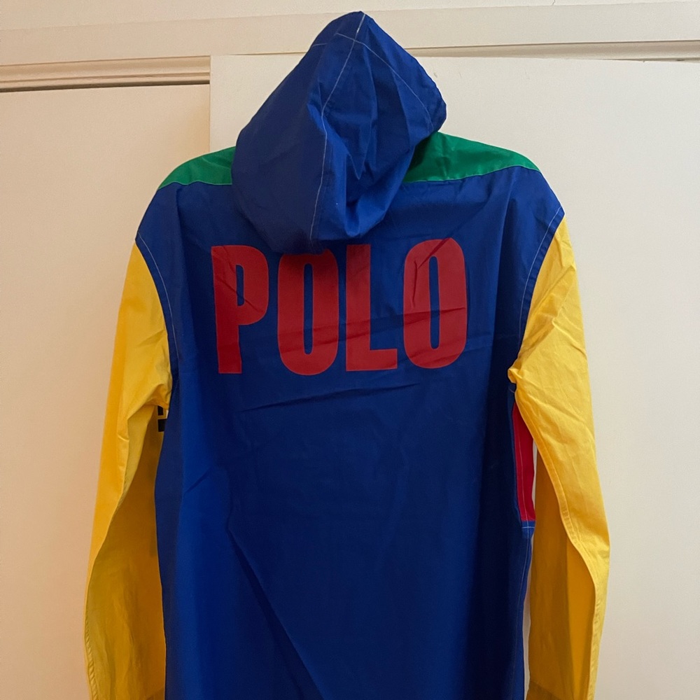 Multi colored shirt with hood and snap cuffs